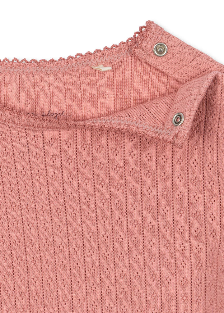 Minnie blusa, Rosette