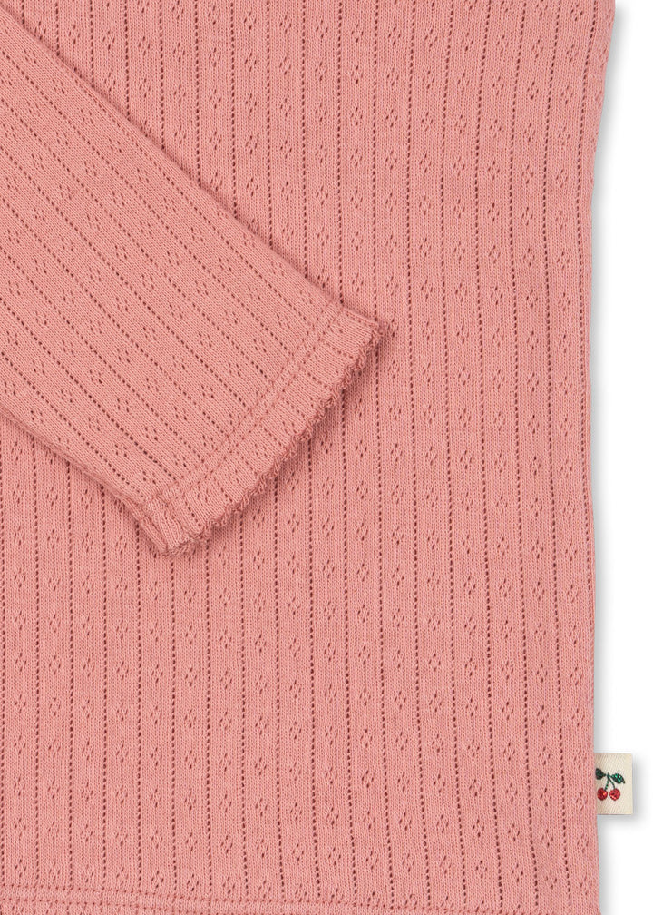 Minnie blusa, Rosette